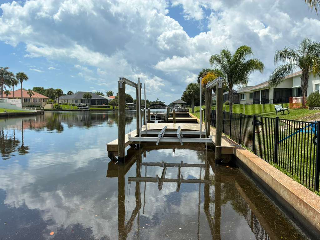 Wide canal view of dock and boat lift project